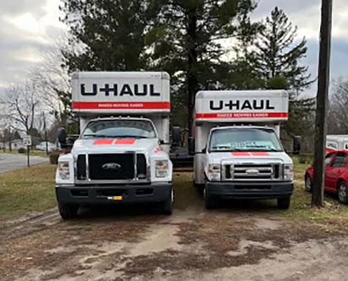 2 different-sized U-Haul trucks